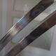 Lampadaire arc Guzzini alu chrome travertin