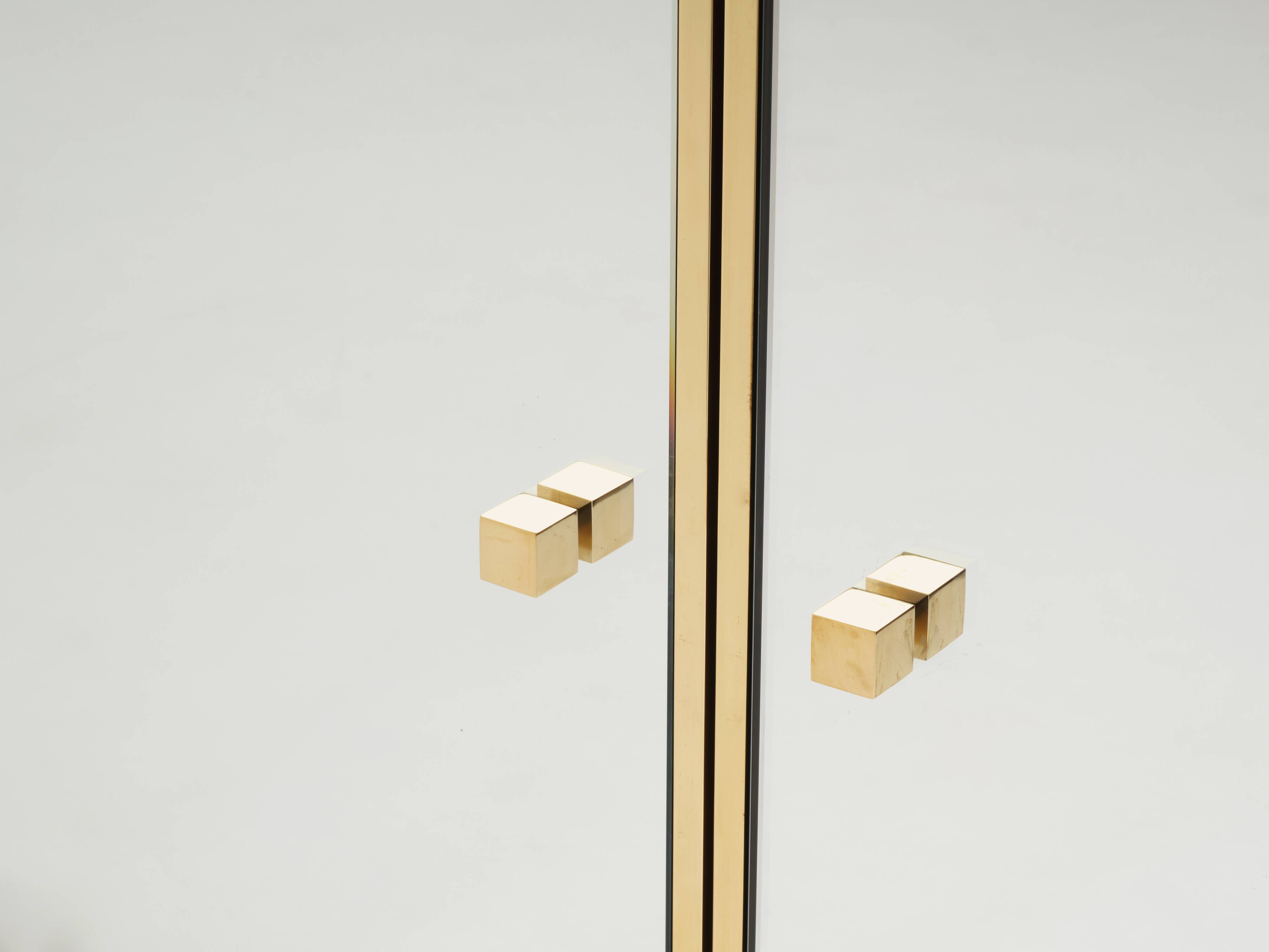 Brass sideboard with mirror and plexiglass legs by Michel Pigneres, 1970