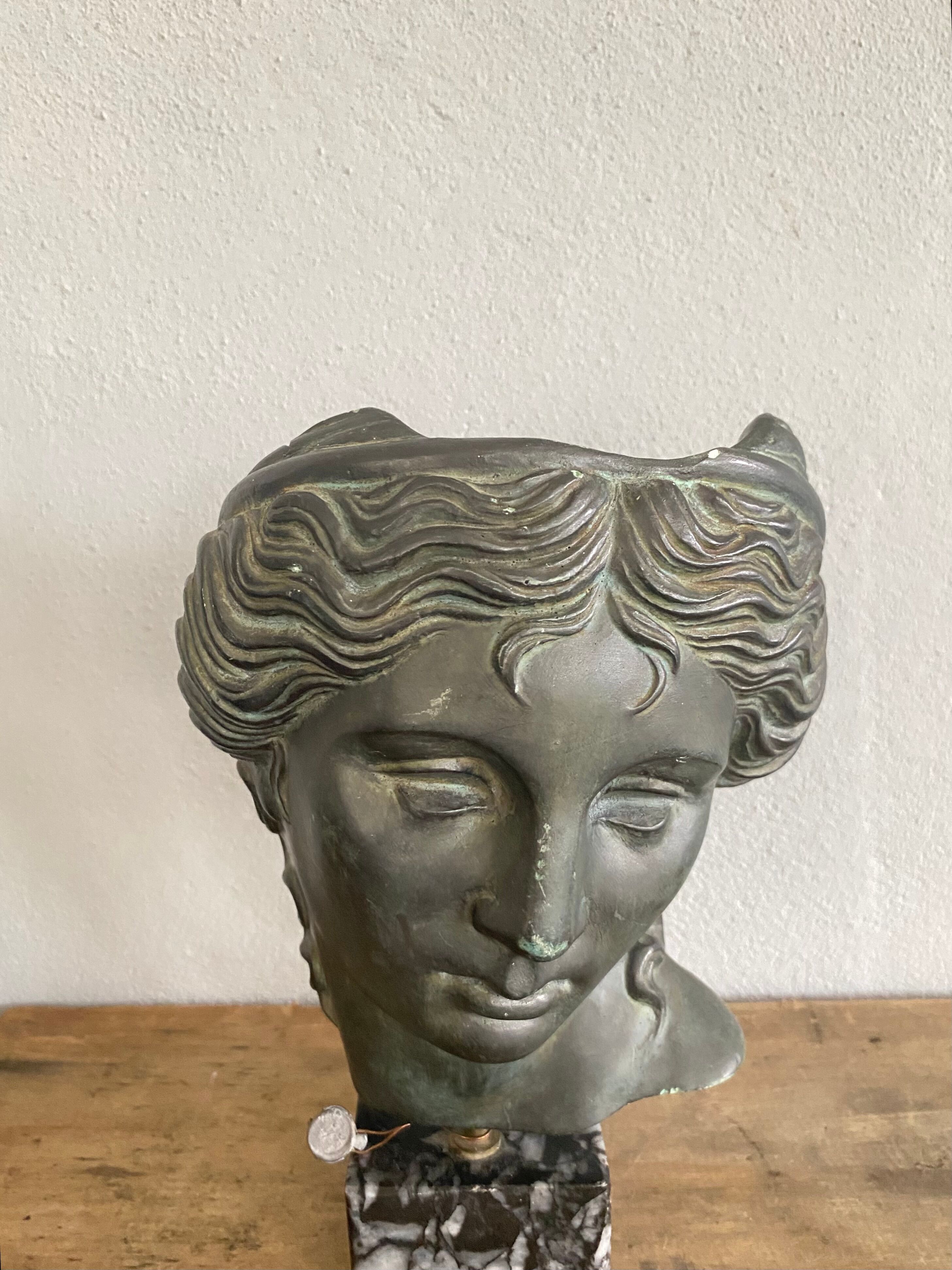 Greek head in patinated plaster with marble base