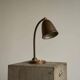 Art Deco table lamp in patinated brass from the 1930s.