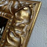 Vintage mirror cut out in a gilded wooden frame