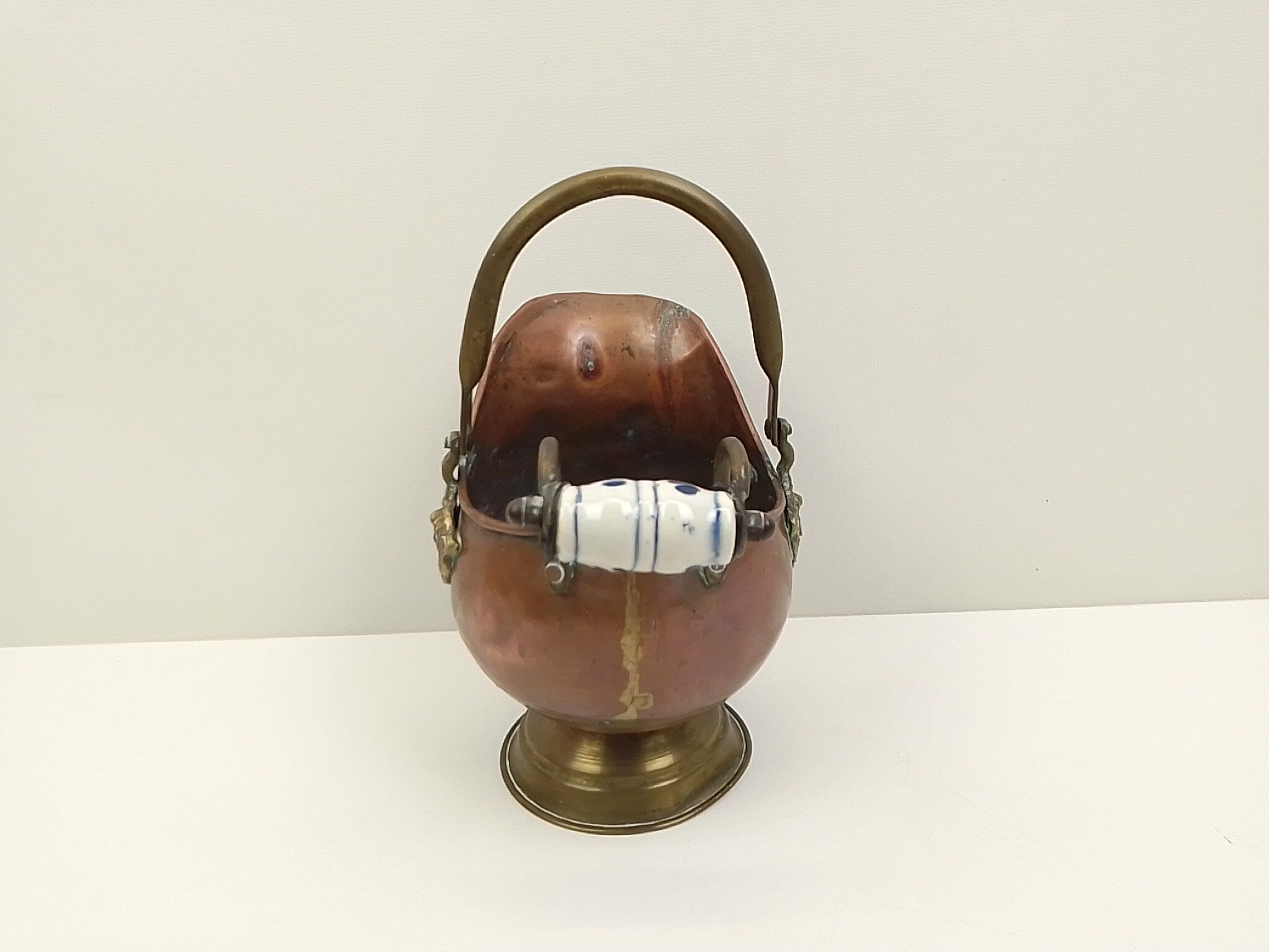 Copper pot cover and a pitcher-style brass handle