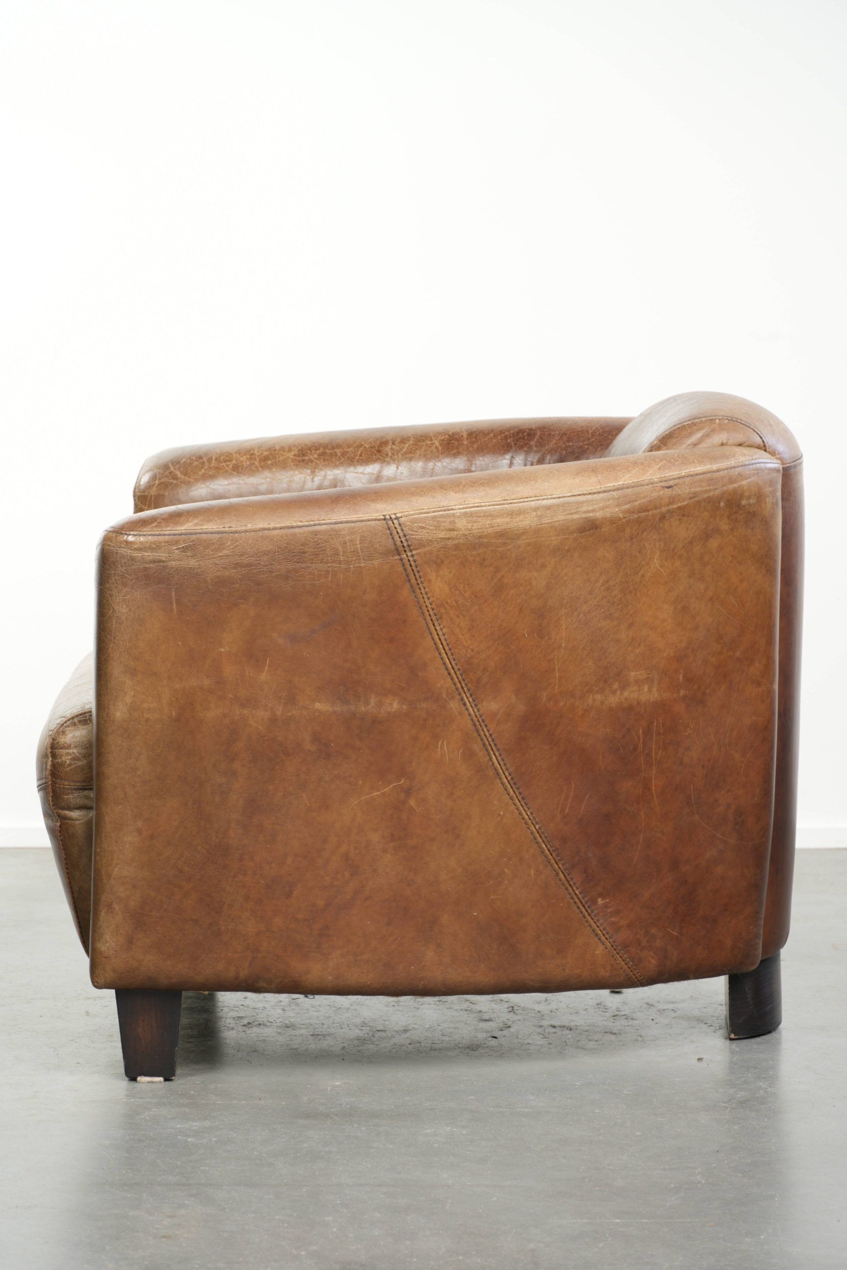 Fauteuil design aviateur en cuir de vache couleur cognac robuste