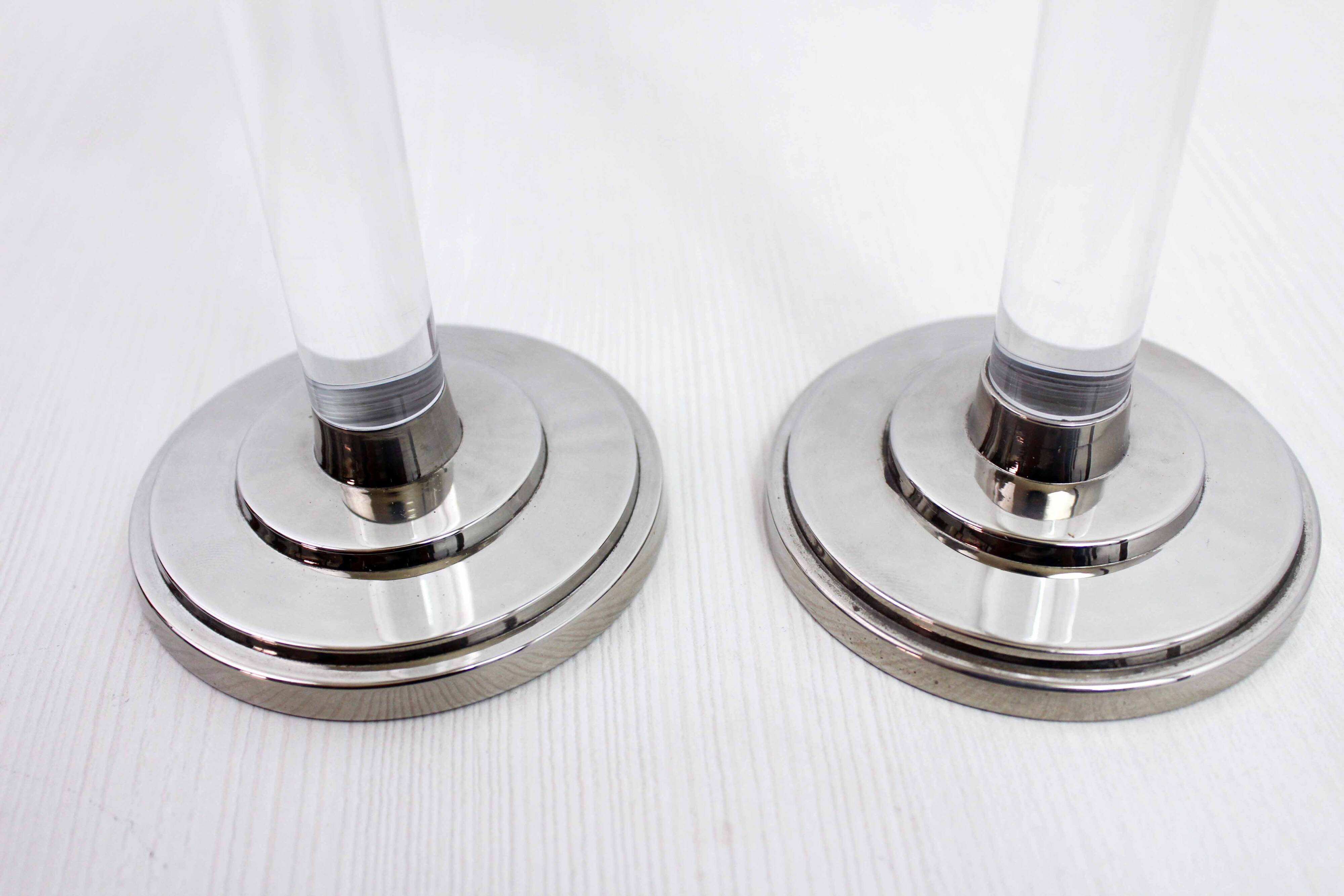 Pair of lucite and silver-plated metal candlesticks