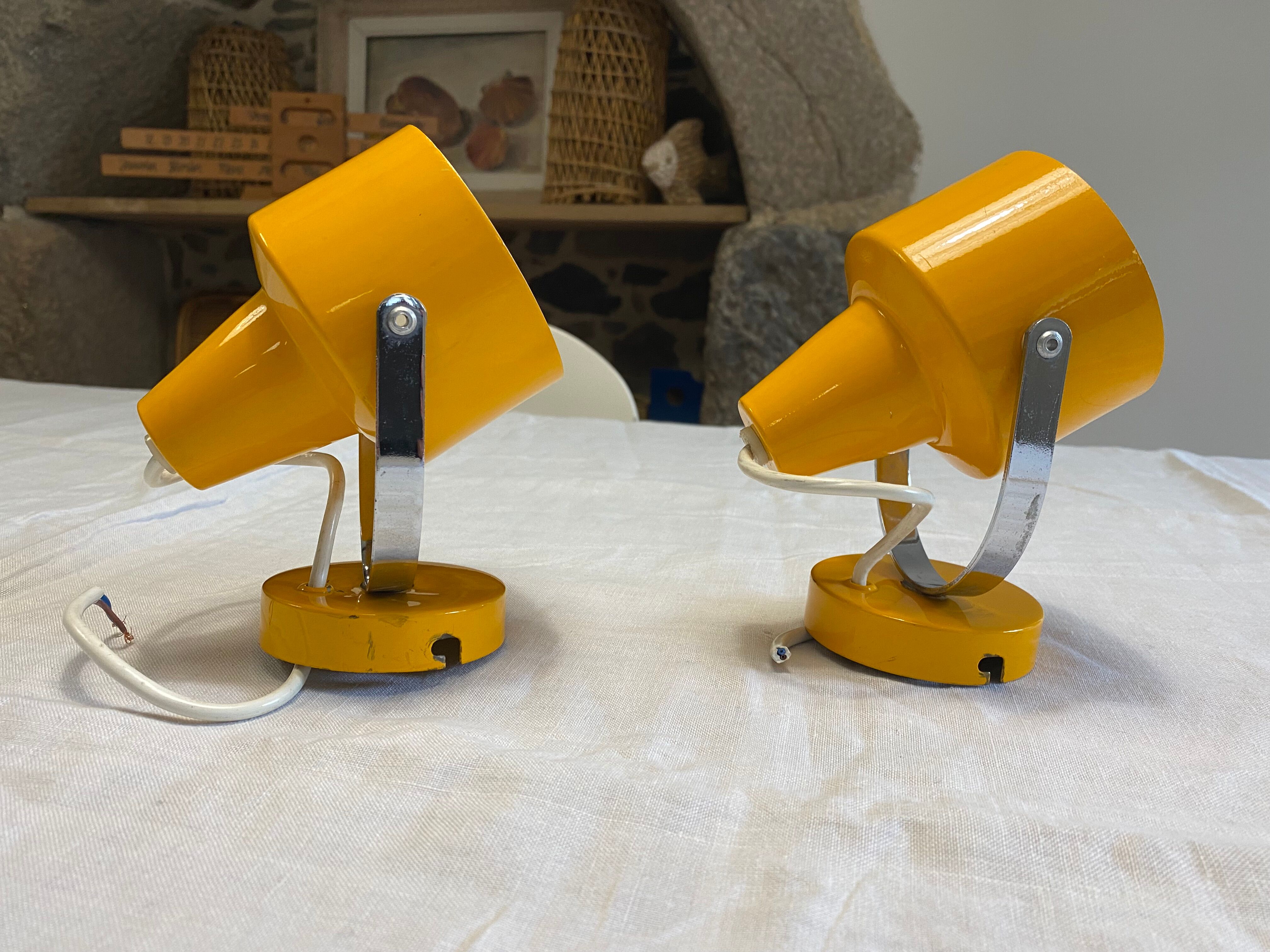 Pair of adjustable vintage wall lamps in yellow and chrome metal. Year 60