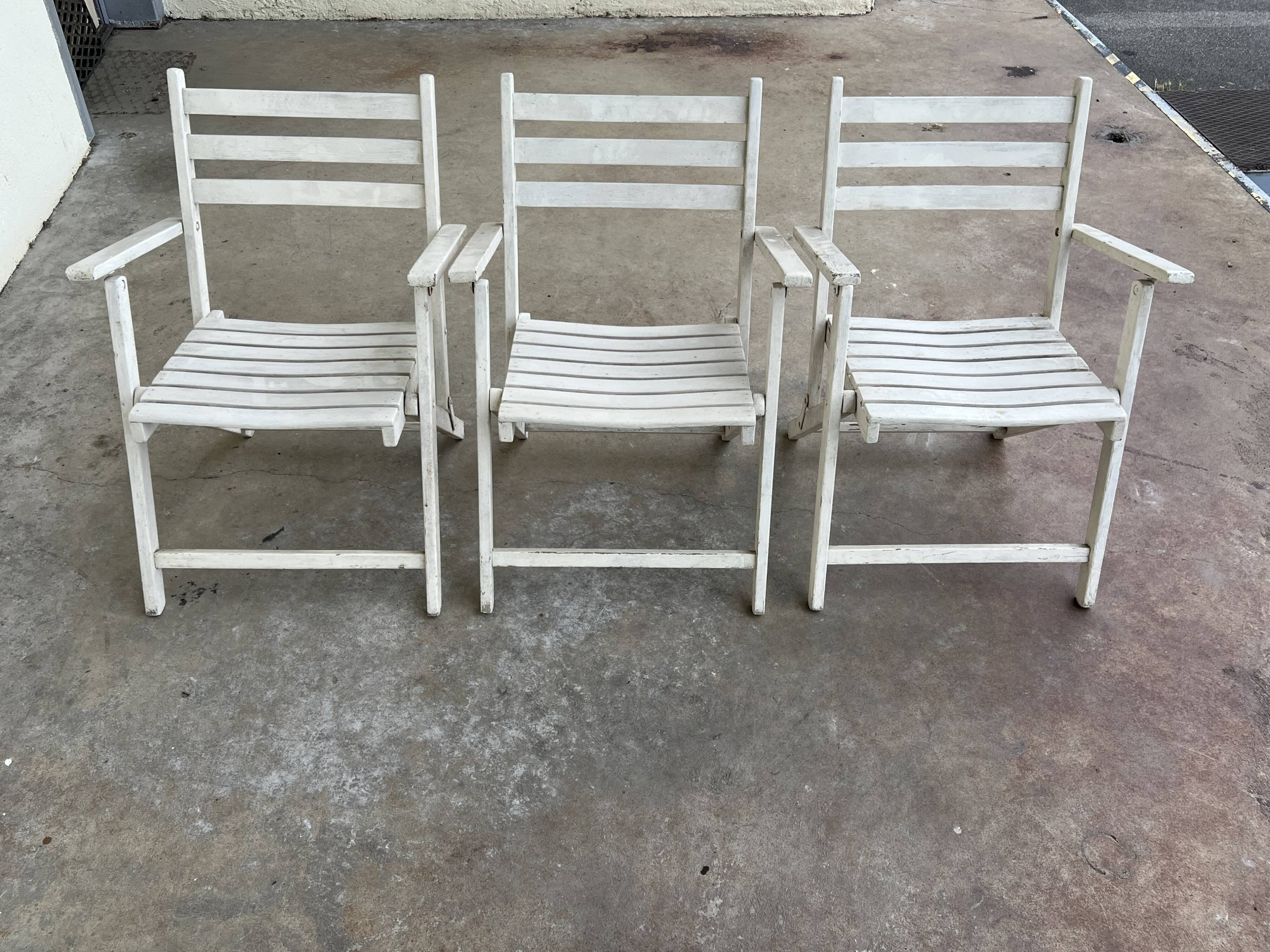 Folding wooden armchairs