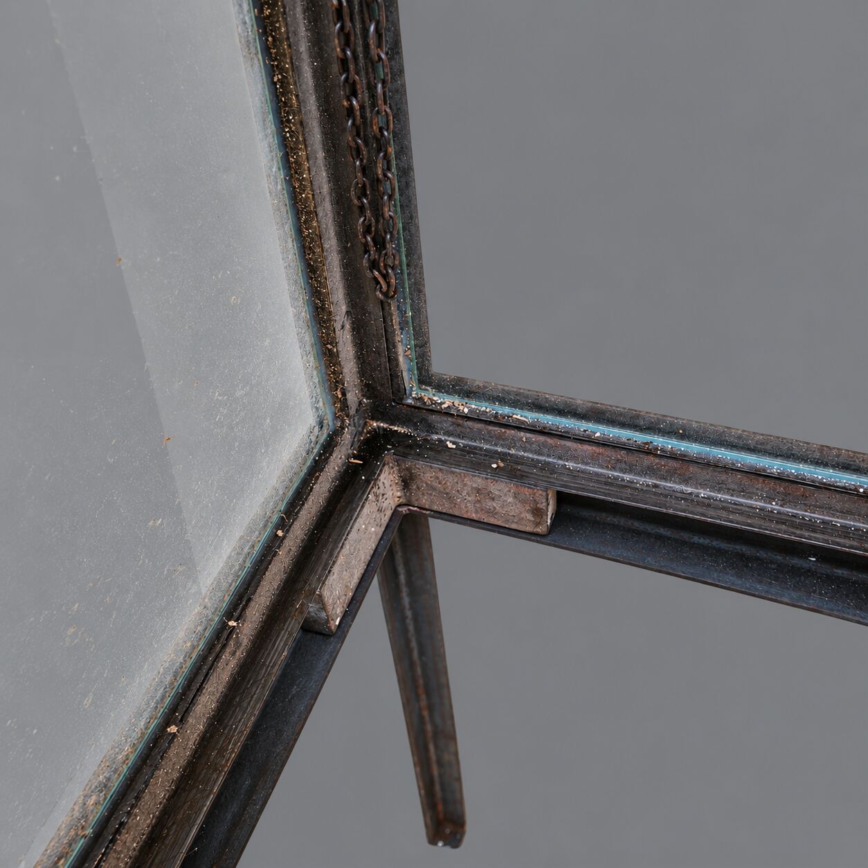 A showcase made of steel and glass, mounted on a custom-made steel base.