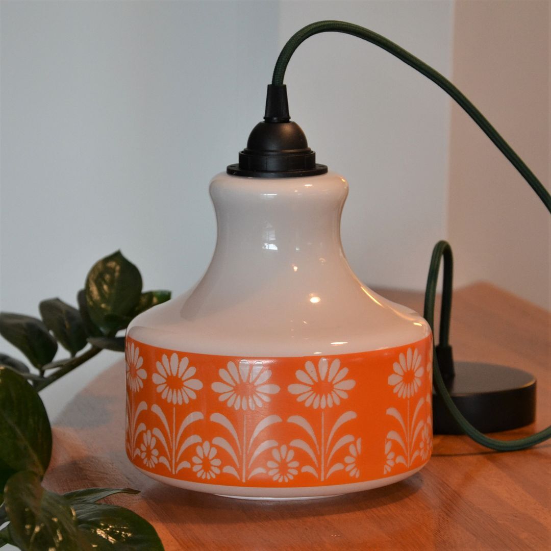 Seventies chandelier in white opaline decorating orange flowers