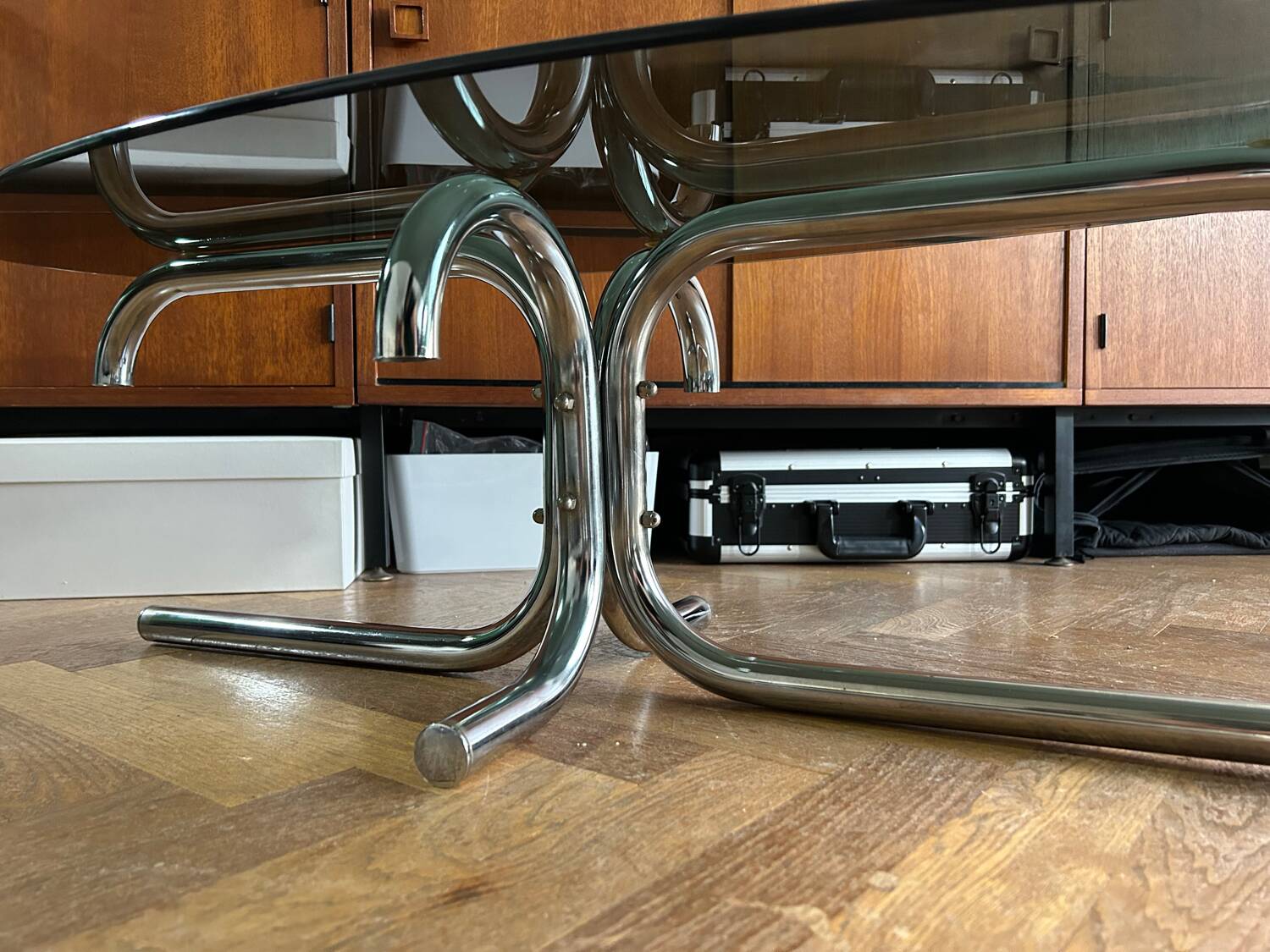 70s design oval coffee table in smoked black glass with chrome legs.