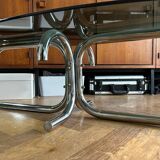 70s design oval coffee table in smoked black glass with chrome legs.