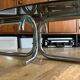 Table basse design ovale années 70 en verre fumé noir et pieds chromé