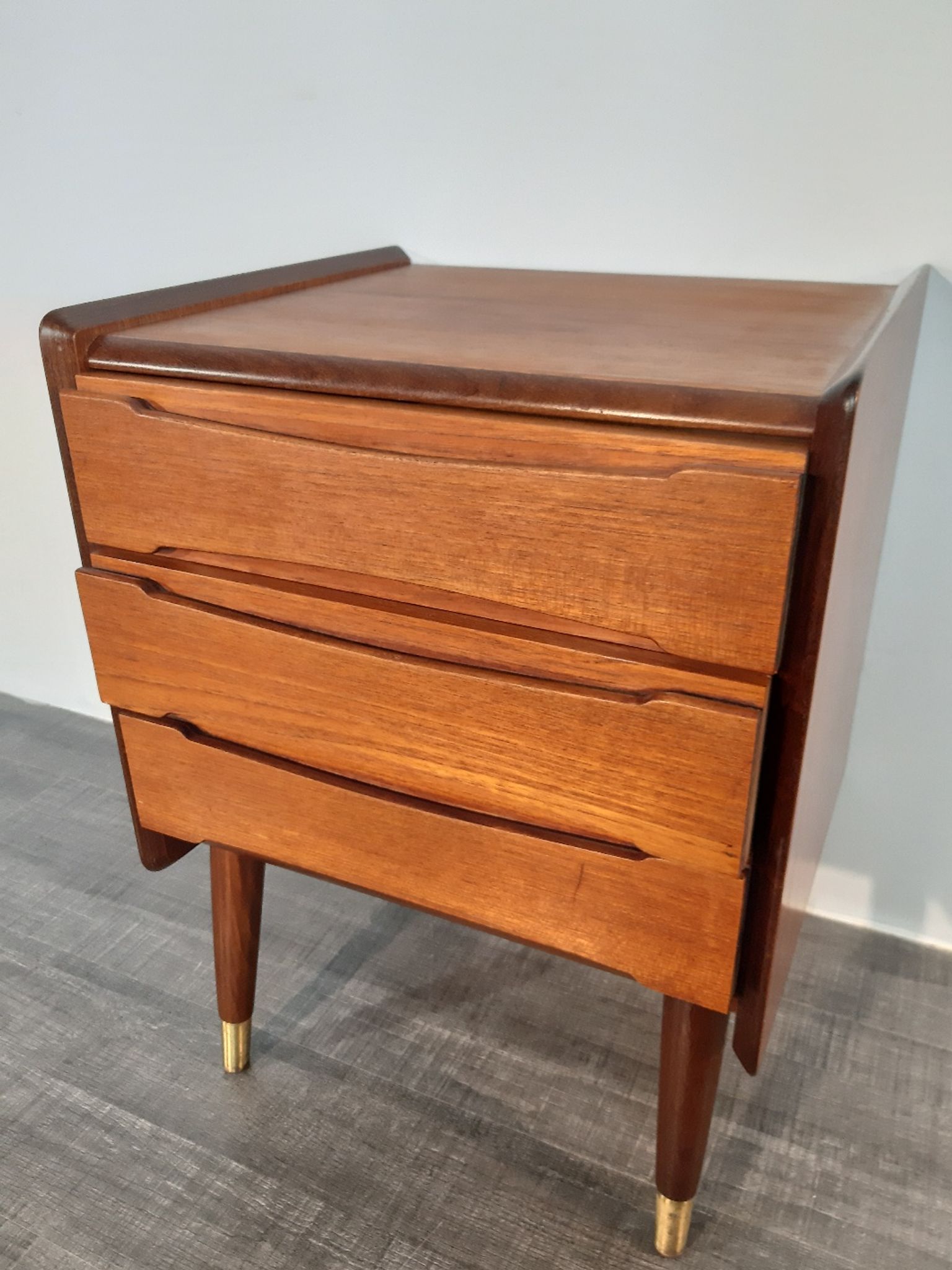 Norwegian bedside table with 3 drawers, teak and brass clogs