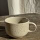 Set of 4 vintage speckled beige stoneware coffee cups.