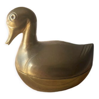 Old duck-shaped box in vintage golden brass