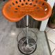Orange tractor stool, pivoting adjustable mower, Fermigier Mirima 70.