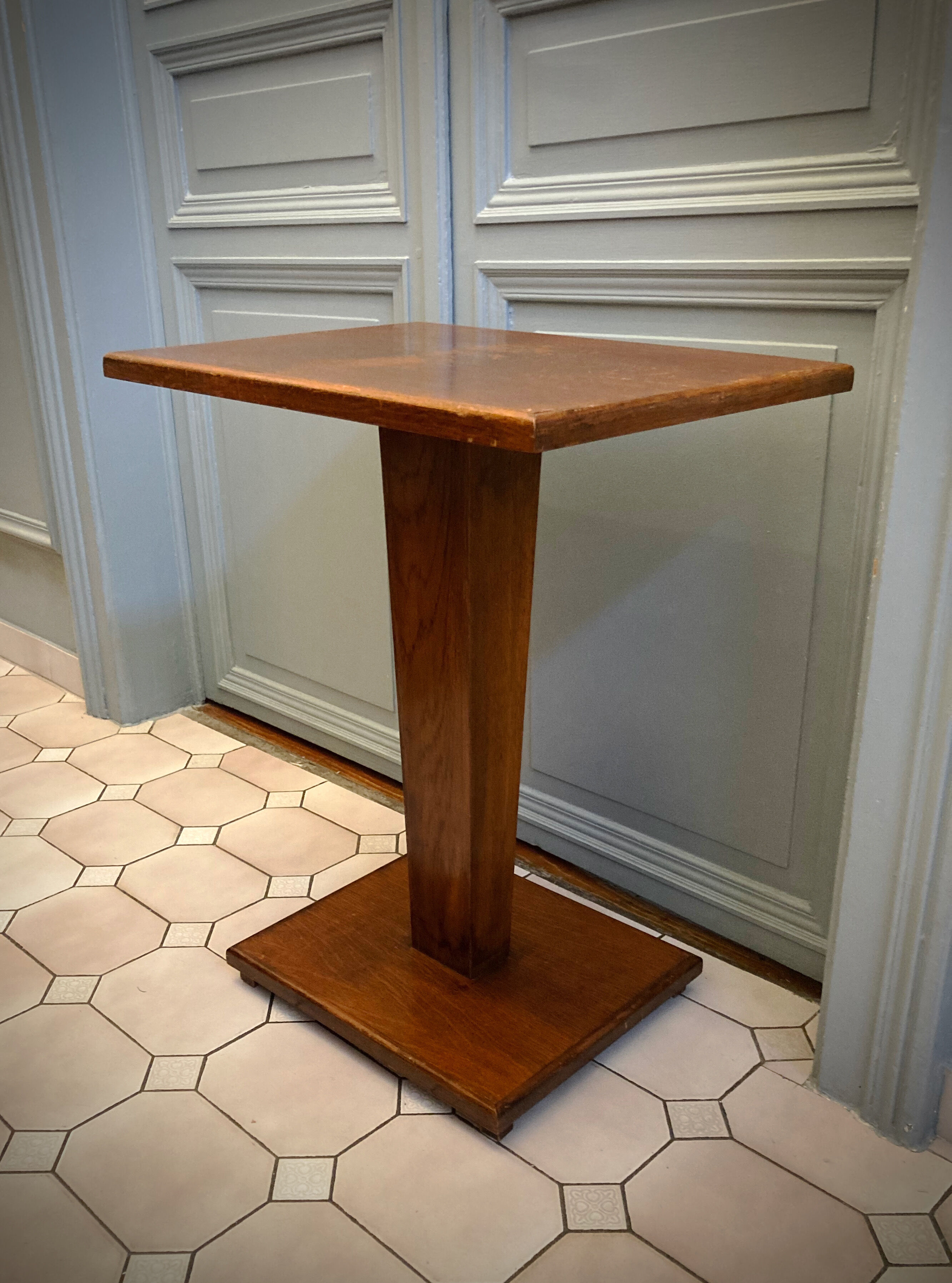 Square pedestal table with central foot 1930