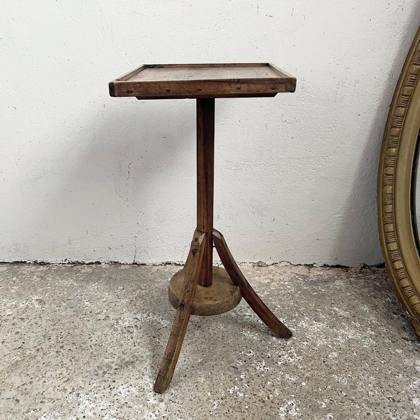Old primitive wooden tripod pedestal table
