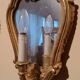 Vintage gold mirror sconces from the late 1950s.