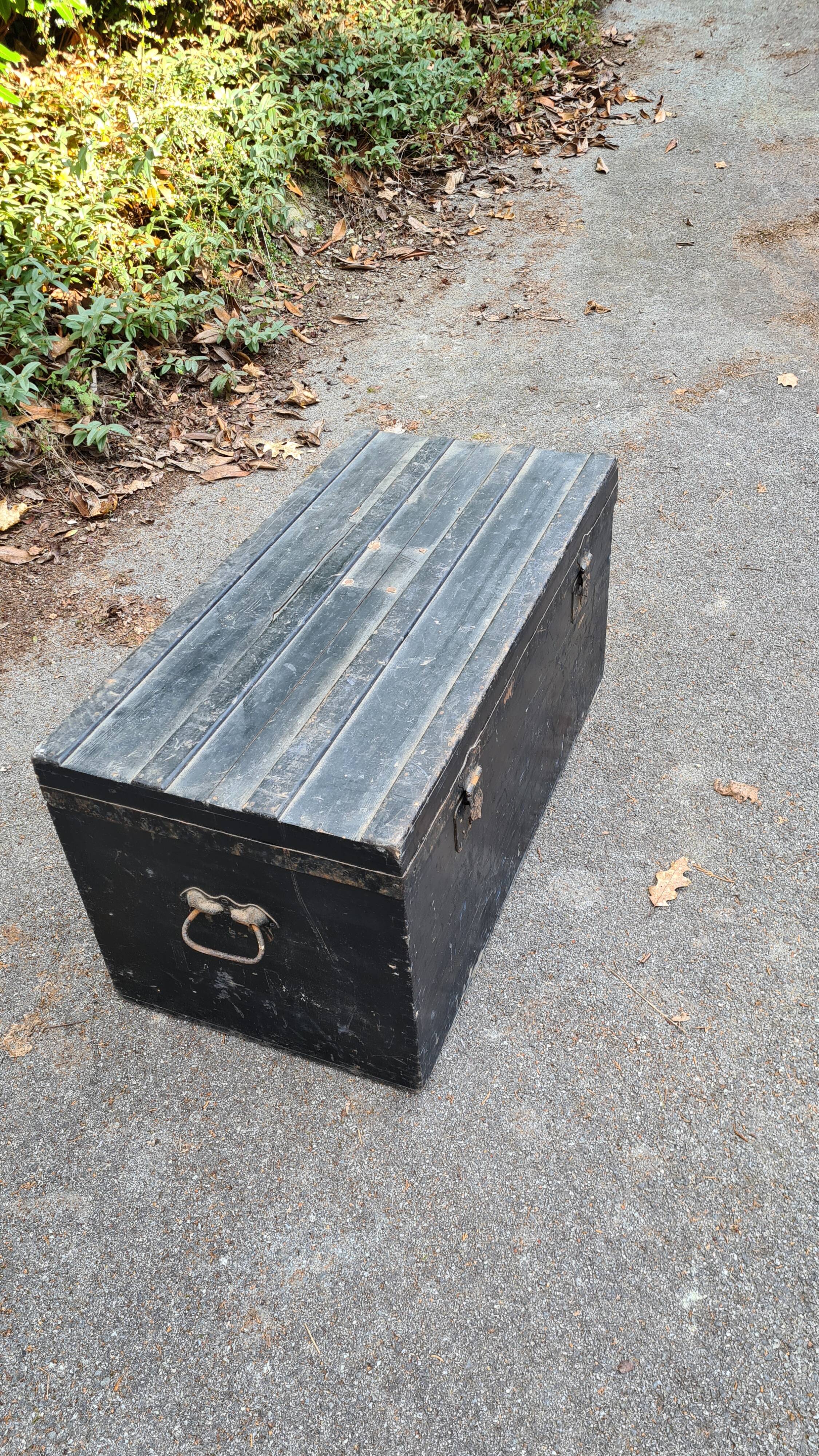 Old wooden trunk with interior compartments