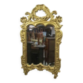 Antique mirror in gilded wood