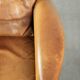 Cognac-coloured Art Deco design armchair made of sheepskin with a high back