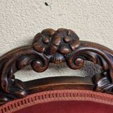 Chair known as a "chauffeuse" from the Napoléon III period, made of carved moulded wood.