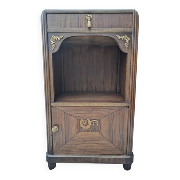 Art Deco bedside table with a green marble top.