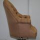 Chesterfield armchair in hardwood, leather, and woven linen.