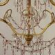 French gilt bronze three-light cage chandelier with pink and clear beaded swags.