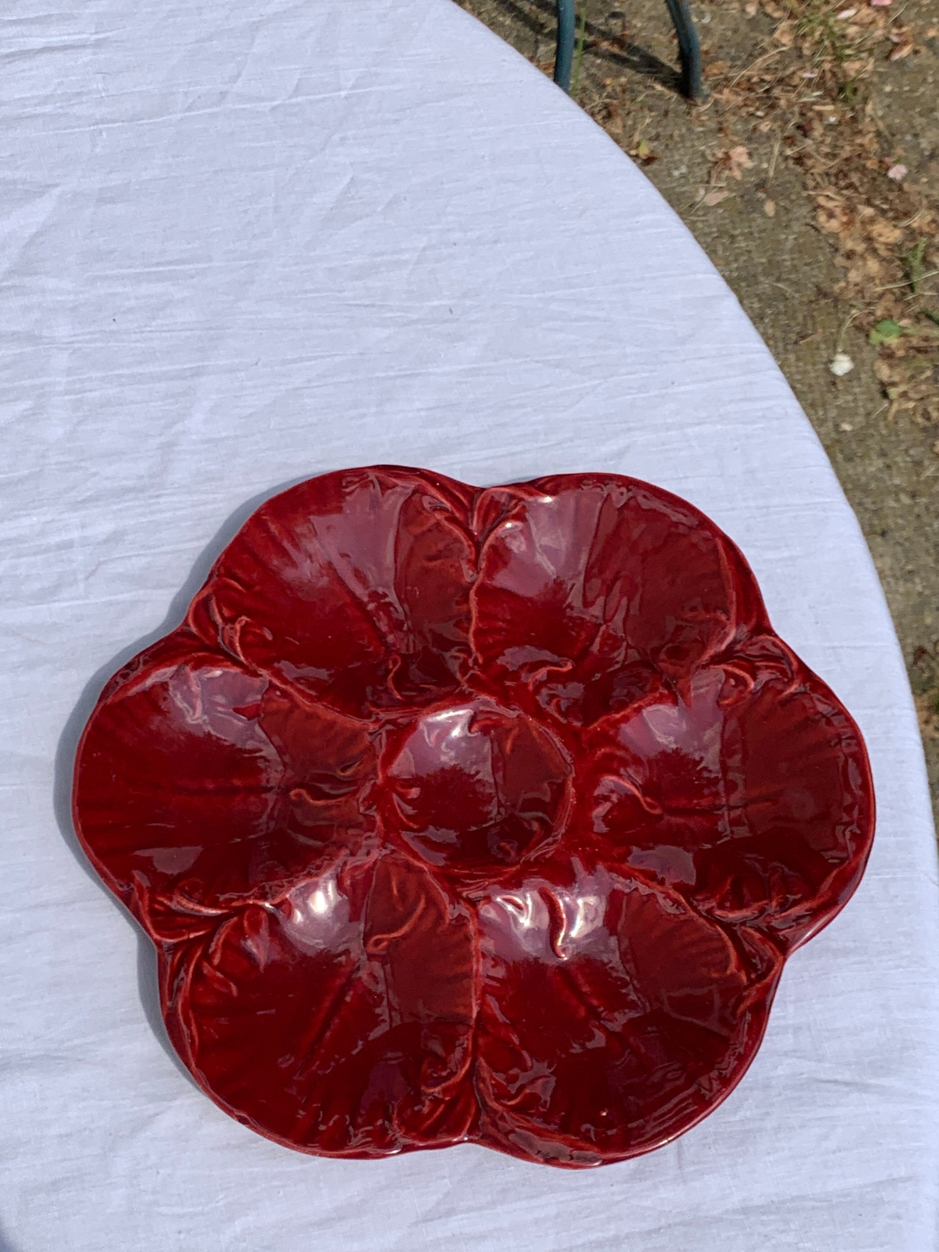 4 oyster plates in vintage red glazed ceramic slip and collector