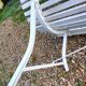Old garden bench with metal legs and wooden slats