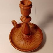 Vintage candlestick holder crafted from turned pine wood Scandinavian-style