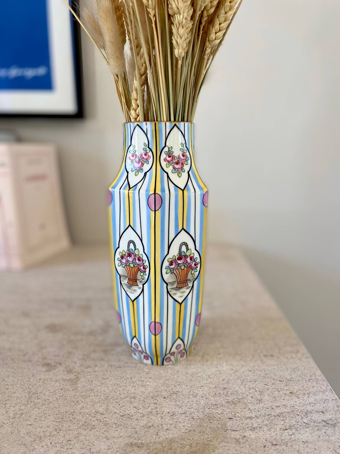Striped ceramic vase with flowers