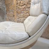 Fauteuil pivotant en cuir patiné gris