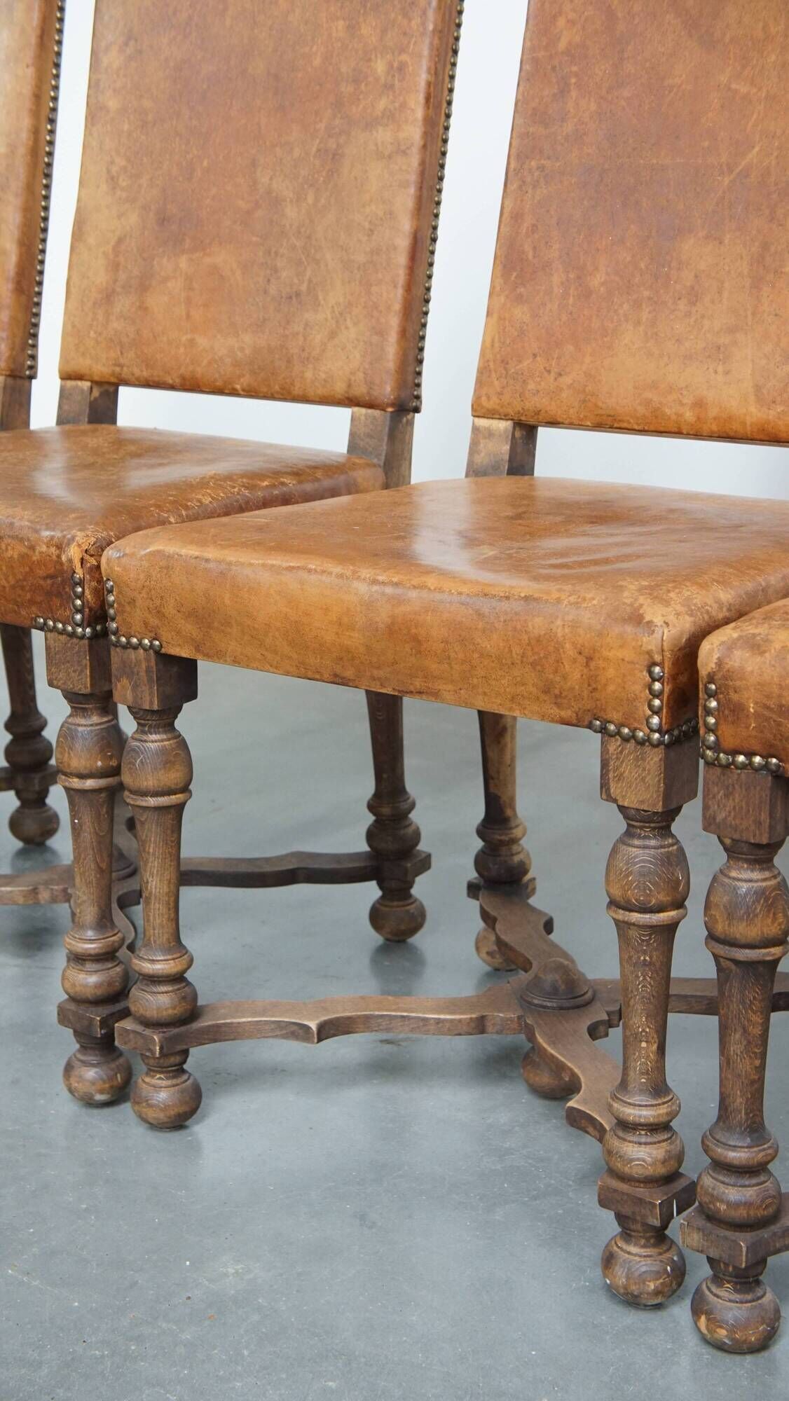 Set of 4 antique wooden and sheepskin leather dining chairs
