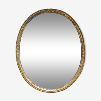 Miroir ovale en métal doré