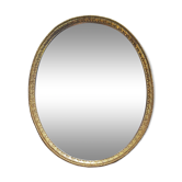 Oval mirror in gold metal