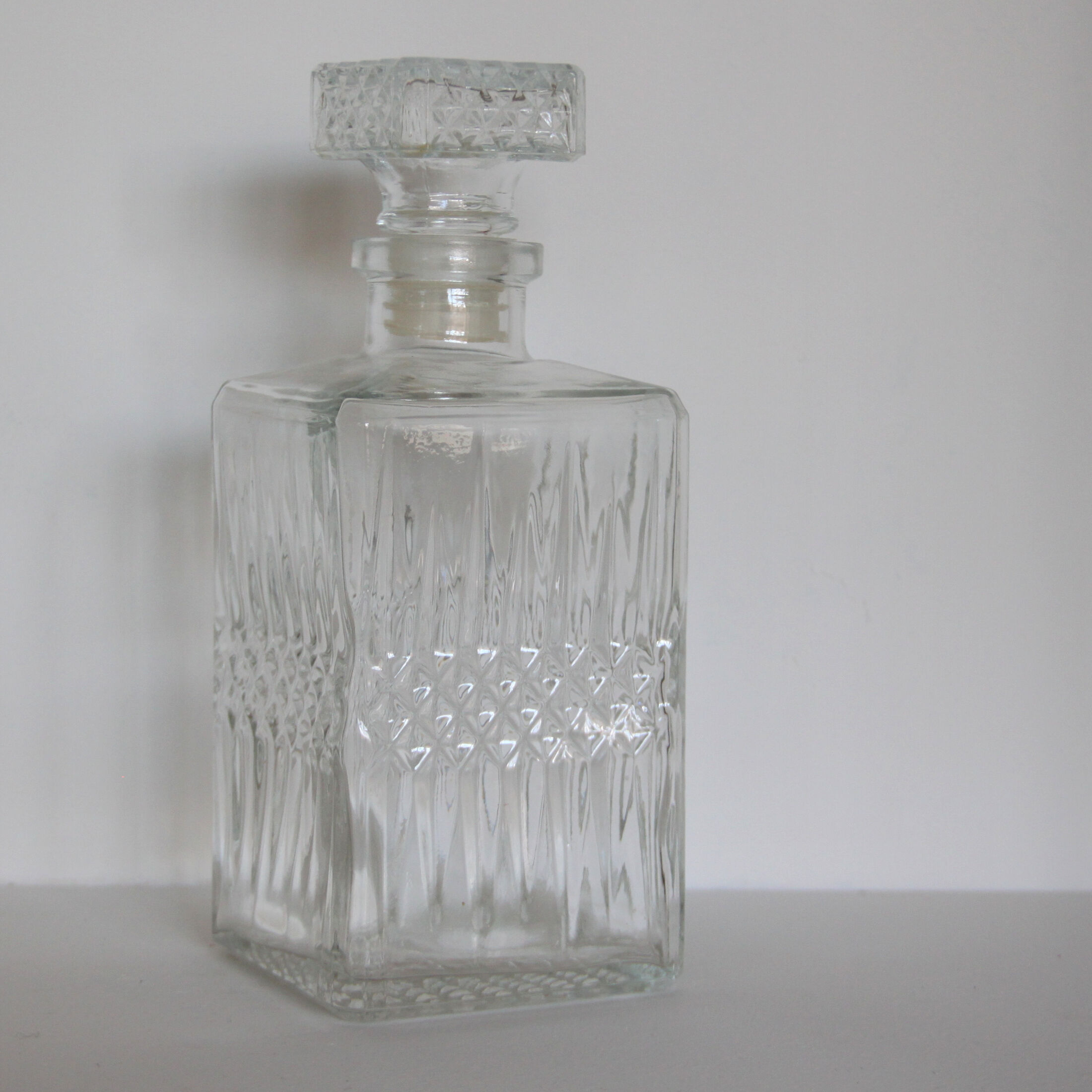 Old vintage glass whisky decanter
