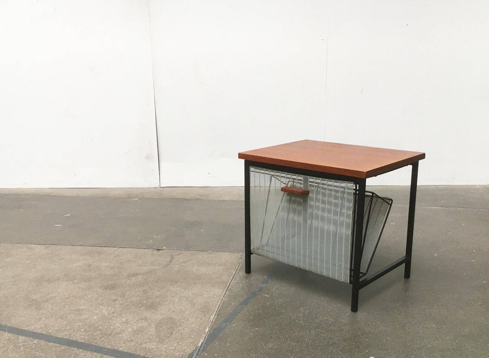 Mid-century teak side table with magazine rack.