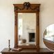 Bevelled mirror in carved wood