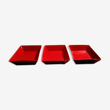 Set of three red ceramic ramekins