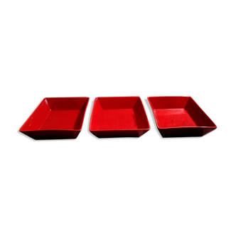 Set of three red ceramic ramekins