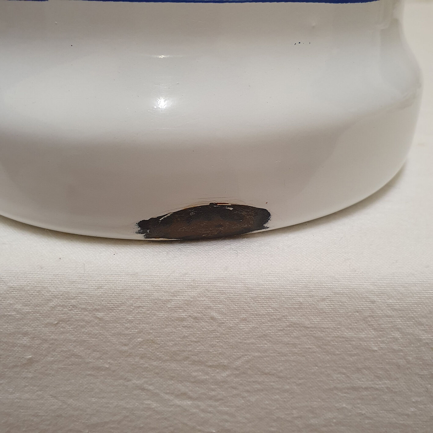 White and blue enamelled kettle