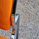 Pair of designer armchairs in orange fabrics and chrome tubes from the 70s