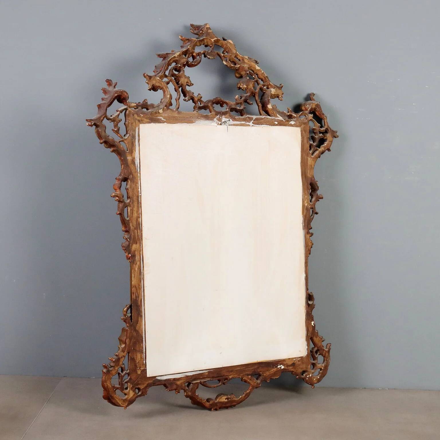 Antique carved and gilded wooden mirror, Italy, early 20th century.