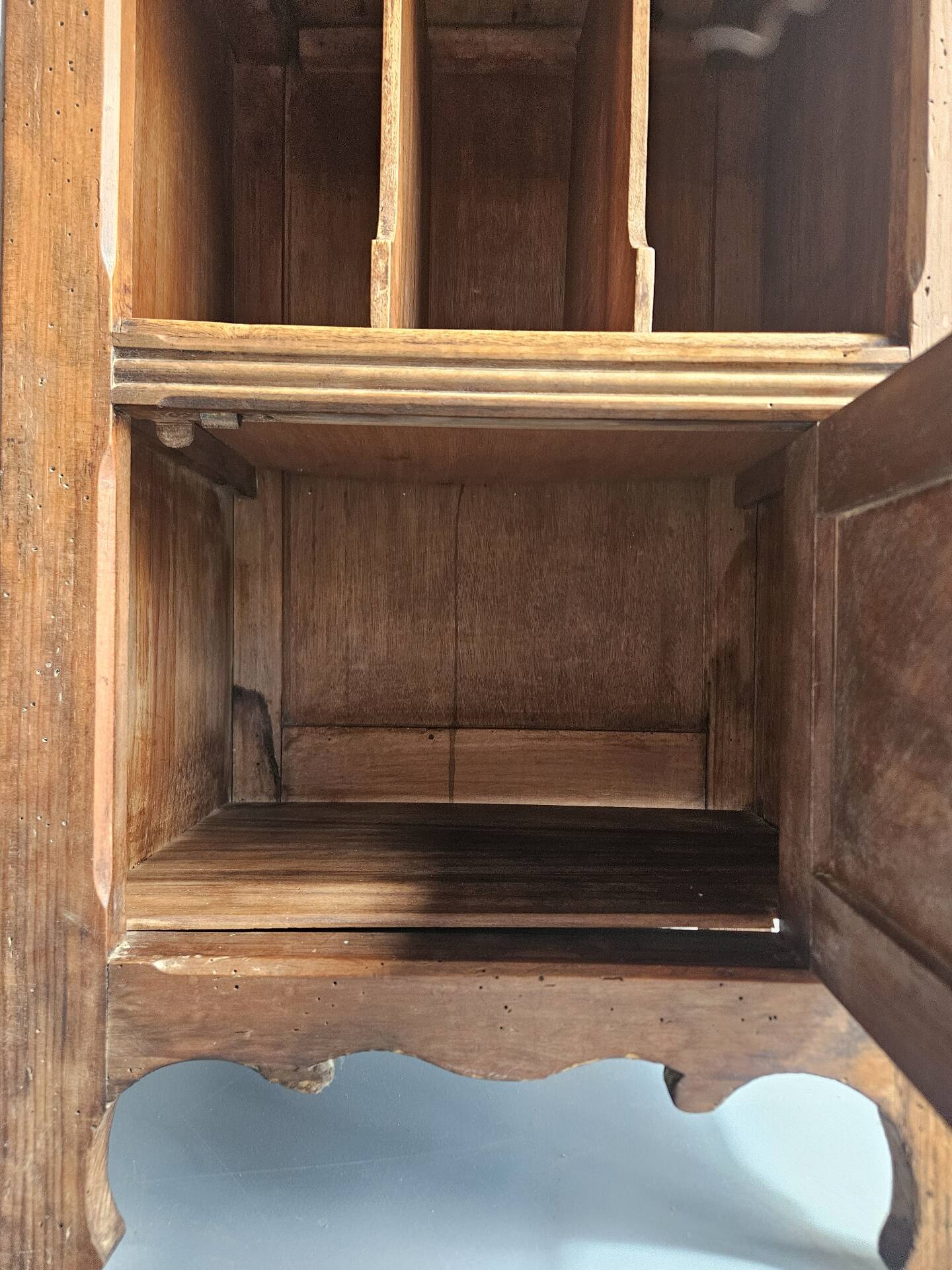 Wooden bedside table with book storage