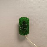 Old wall lamp made of hard pressed green glass.