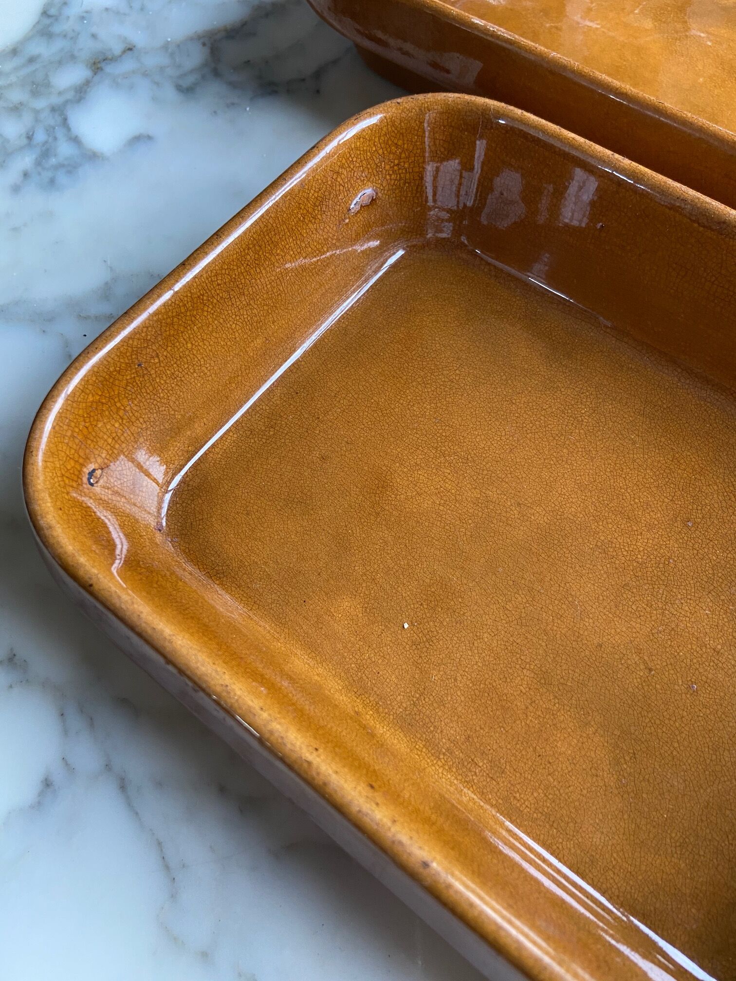 Pair of rectangular enamelled sandstone dishes
