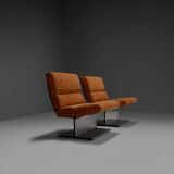 Very rare pair of leather and steel lounge chairs by Paul Geoffroy for Uginox