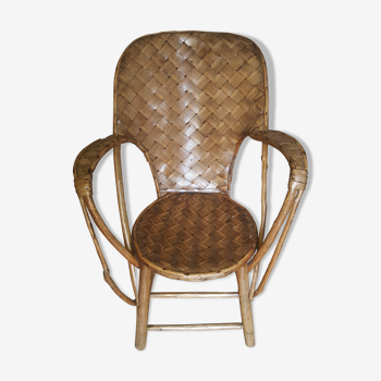 Old chair in braided chestnut